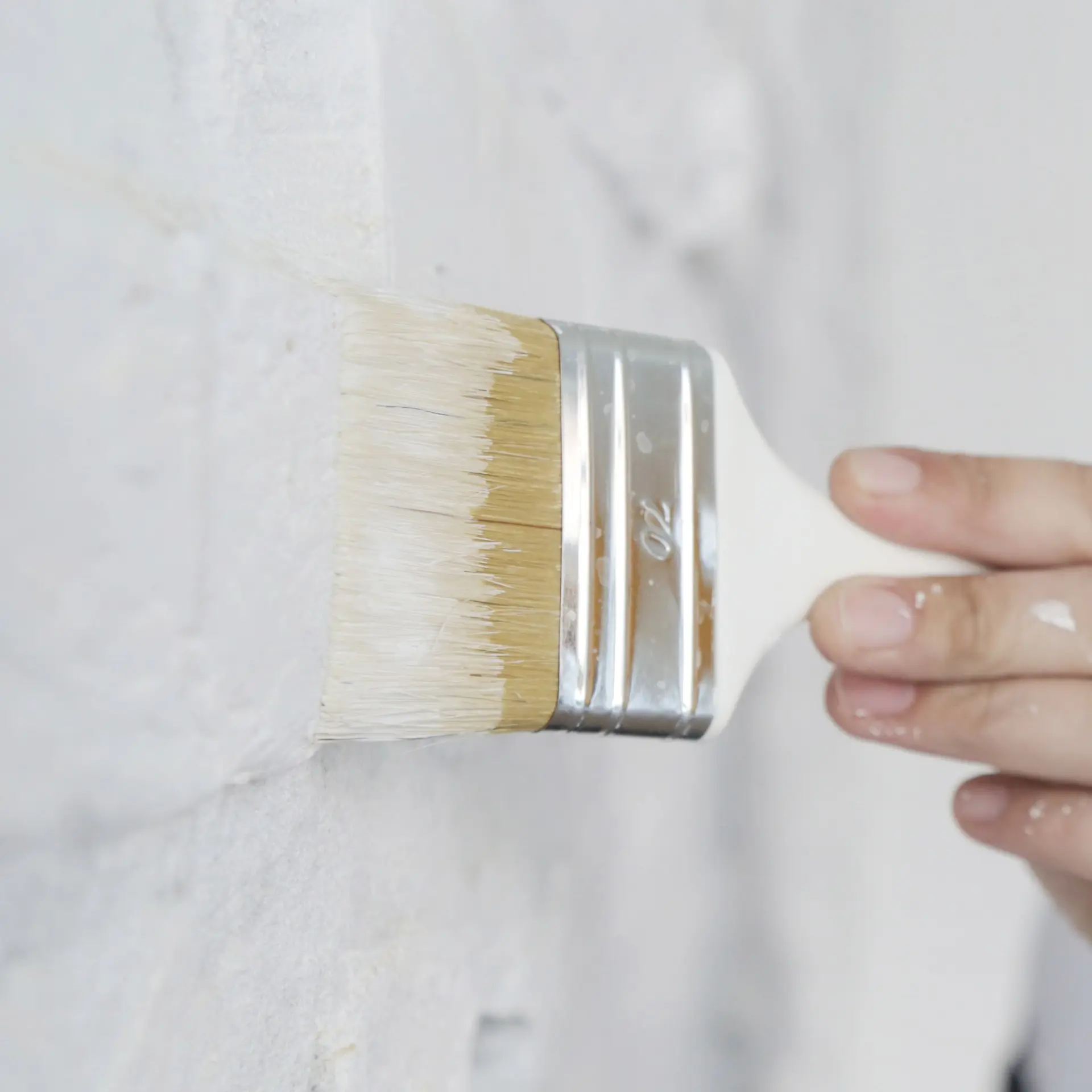 Applying paint to a wall